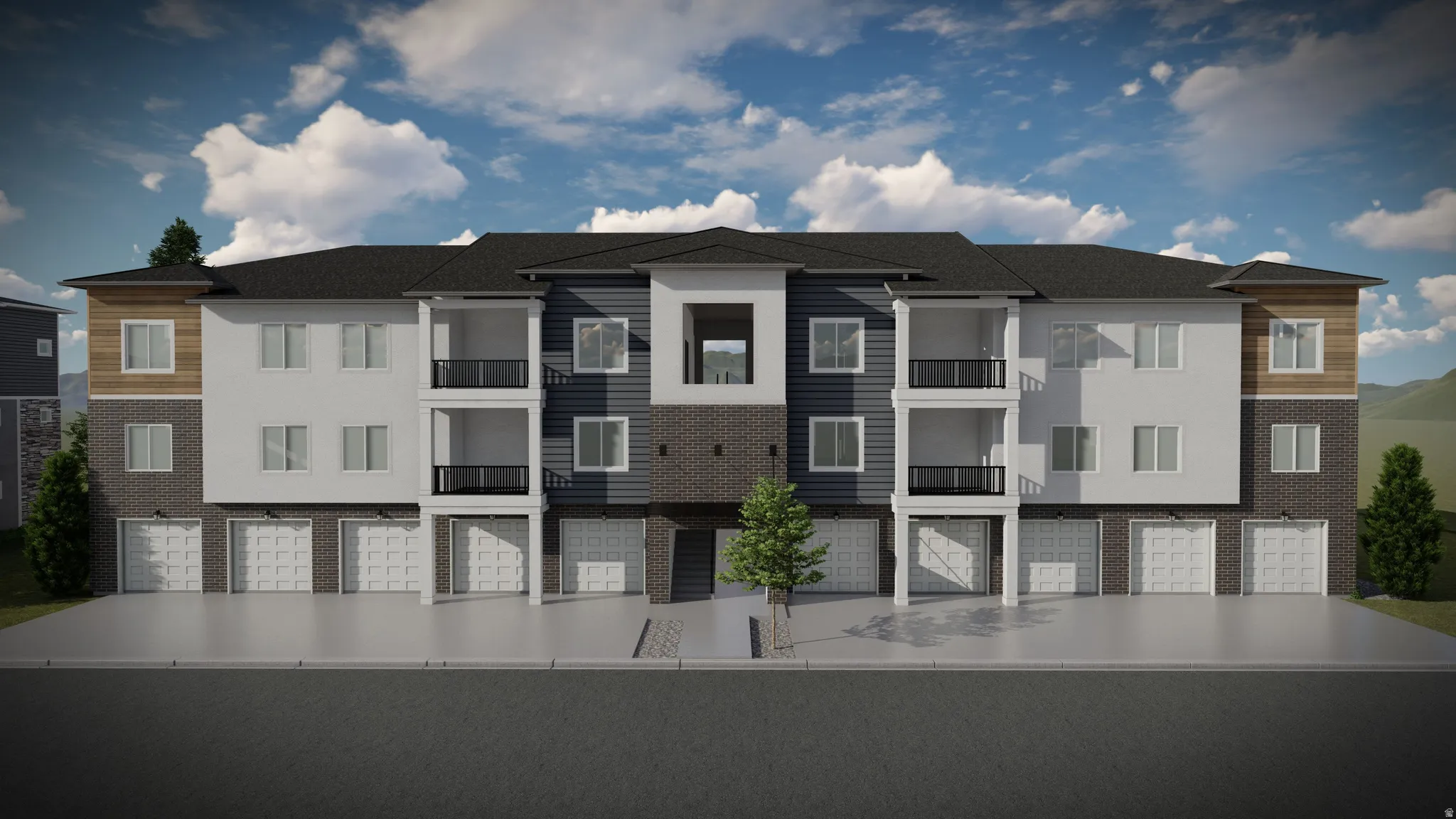 Contemporary multi-story building featuring a dark shingle roof and a façade with light siding, dark horizontal siding, and brick accents