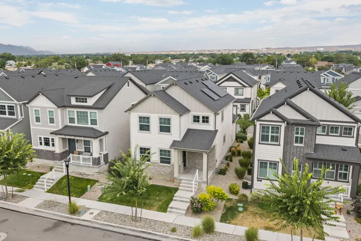 Contemporary architectural design with gabled roofs and dark shingles