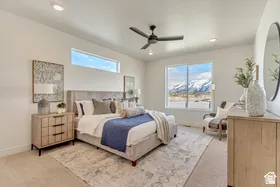 Spacious room featuring a large picture window, a transom window, recessed lighting, and a ceiling fan