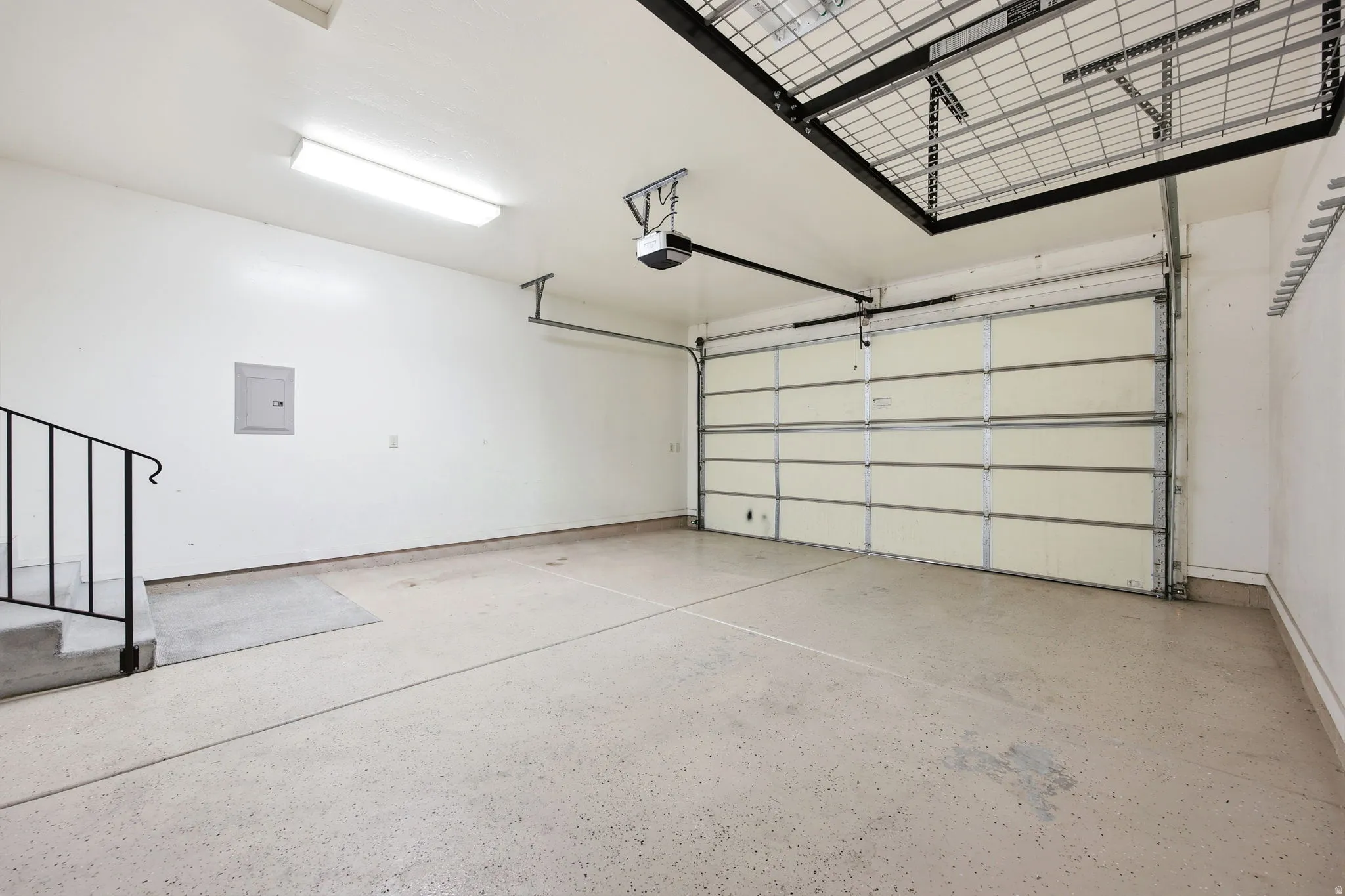 Garage with overhead storage and epoxy floors