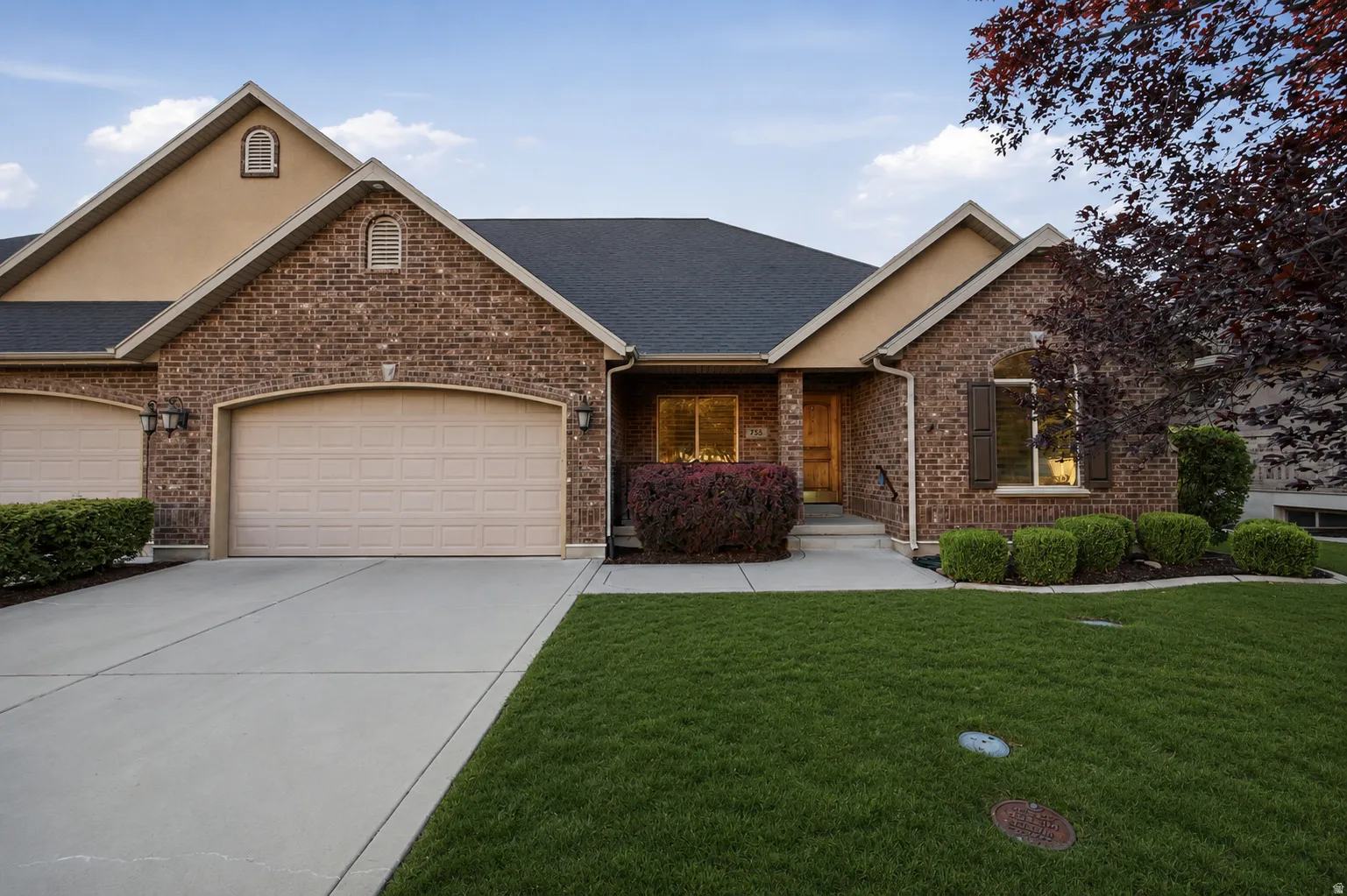 Brick and stucco exterior with multiple gables