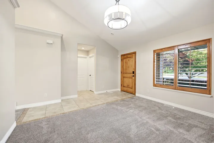 Entry with view of entrance to second bedroom and bathroom