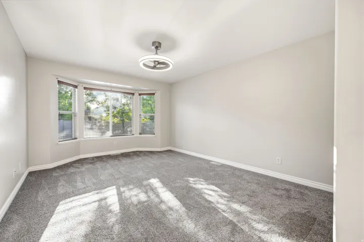 Primary bedroom with bay windows