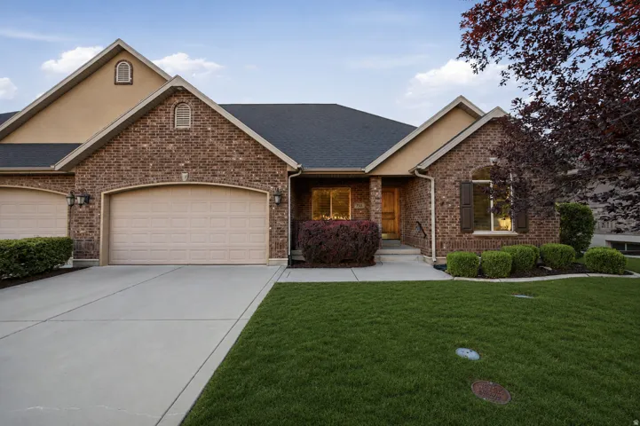 Brick and stucco exterior with multiple gables