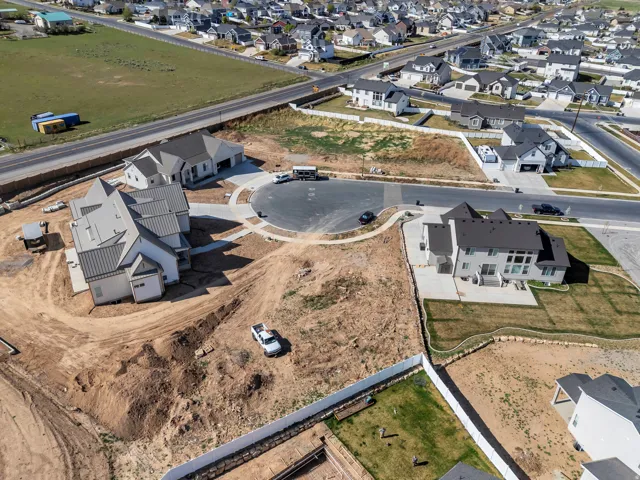 Newly constructed residences featuring modern architecture and dark metal roofing