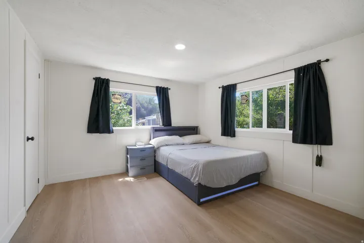 Bright room featuring light wood-finish flooring and white walls