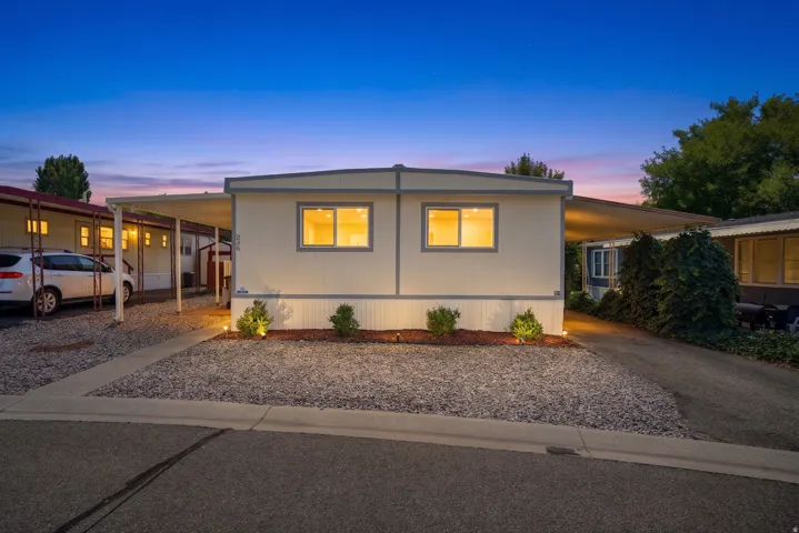 Cream-colored exterior featuring a flat roofline and contrasting trim