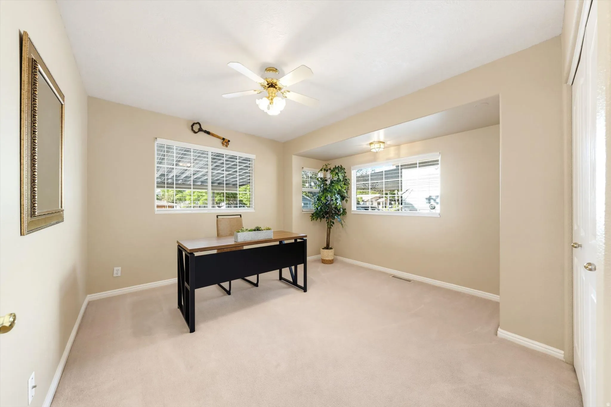 Neutral-toned walls, recessed lighting, ceiling fan light fixture, white window blinds, and carpeted flooring