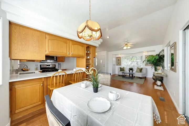Kitchen featuring wood cabinetry, white countertops, and a white subway tile backsplash