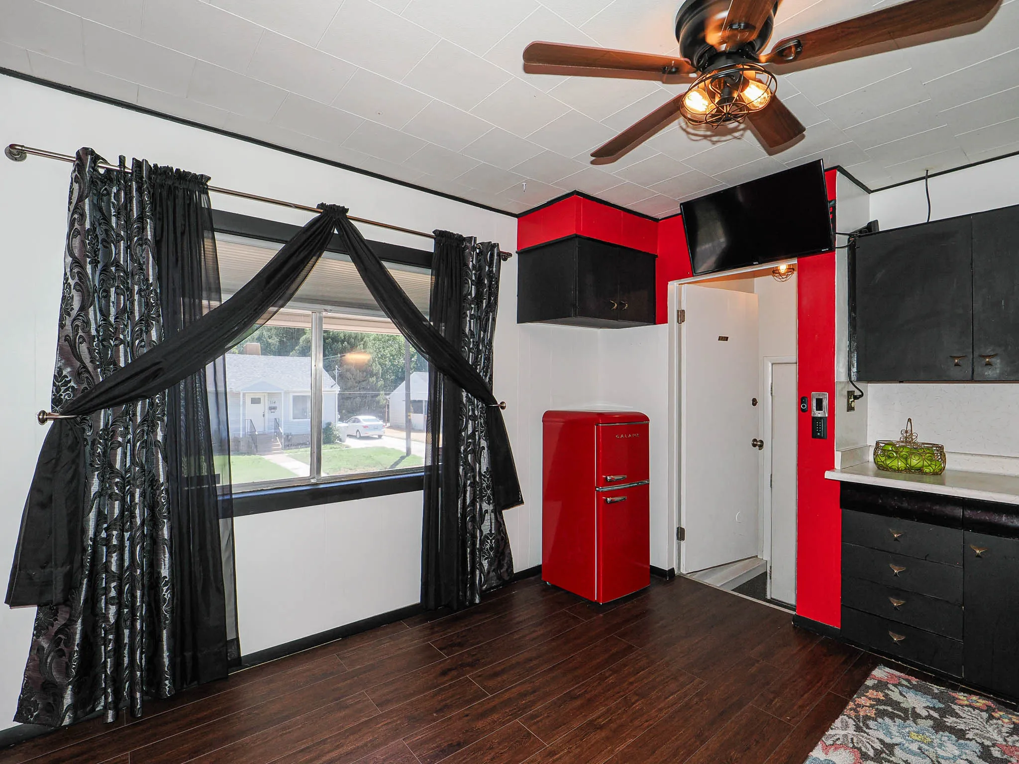 Wood-finish flooring throughout and a good sized picture window.