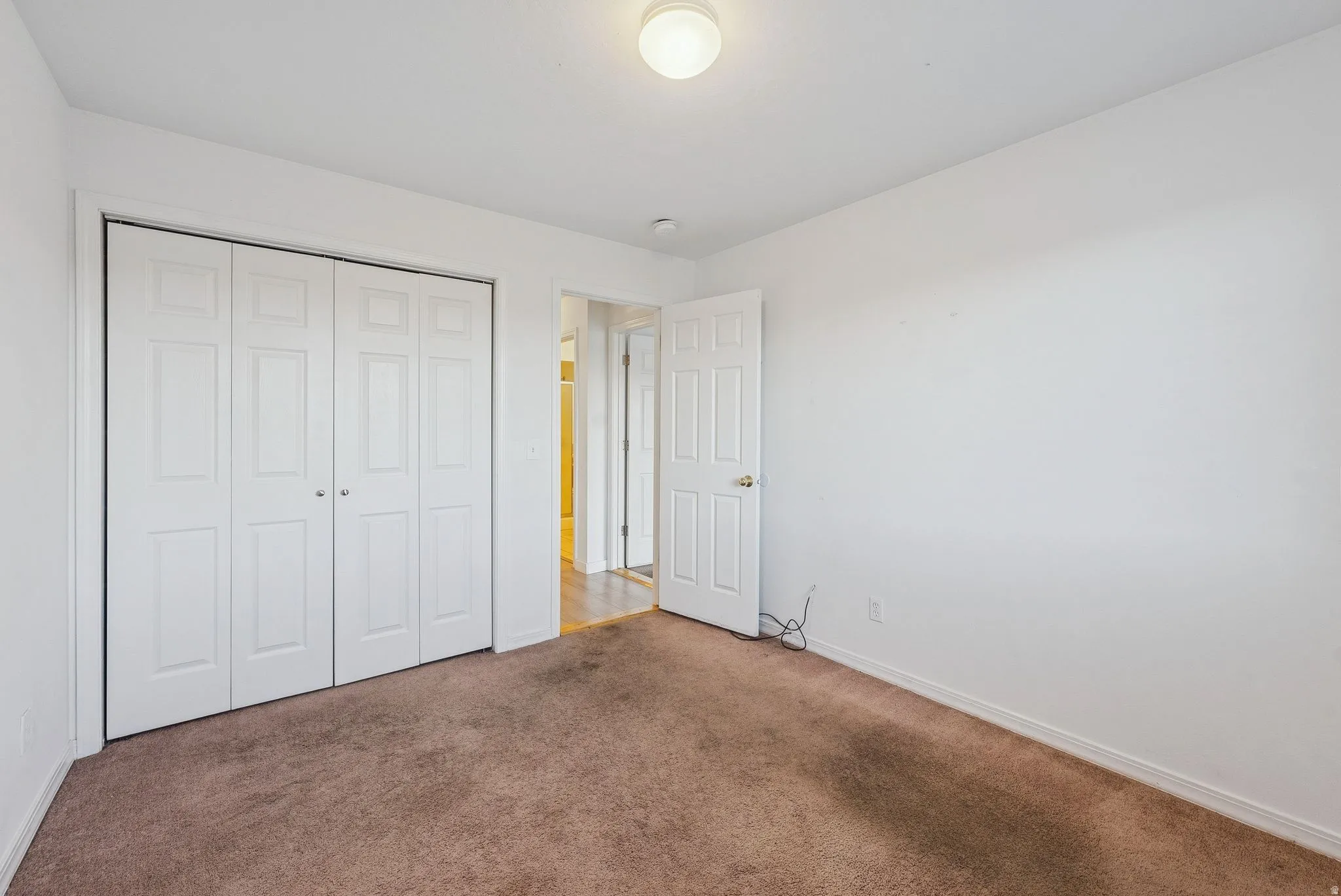 Neutral-toned carpeting paired with white walls
