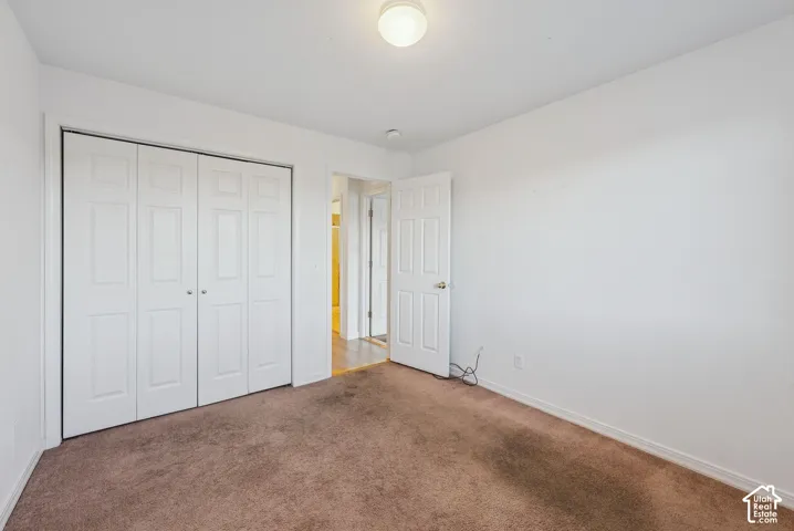 Neutral-toned carpeting paired with white walls