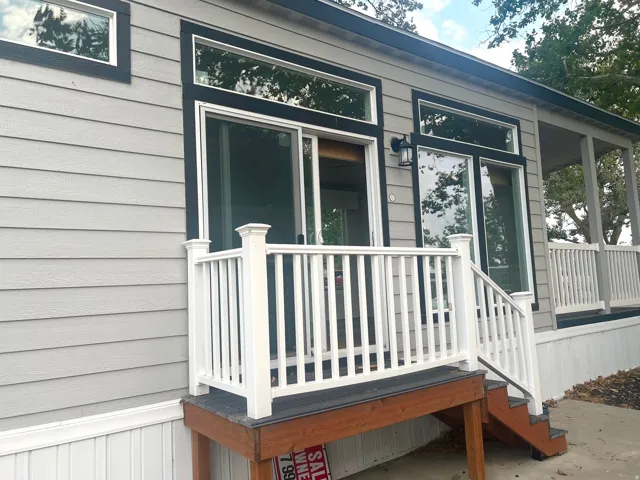 Light gray horizontal siding with black trim details
