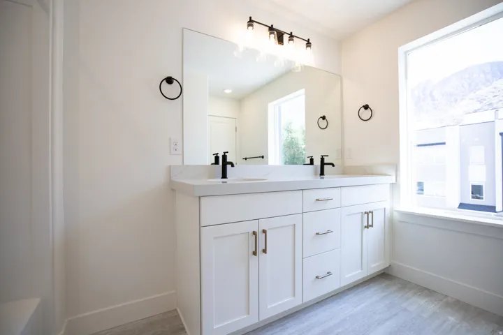 Primary bathroom featuring dual vanity