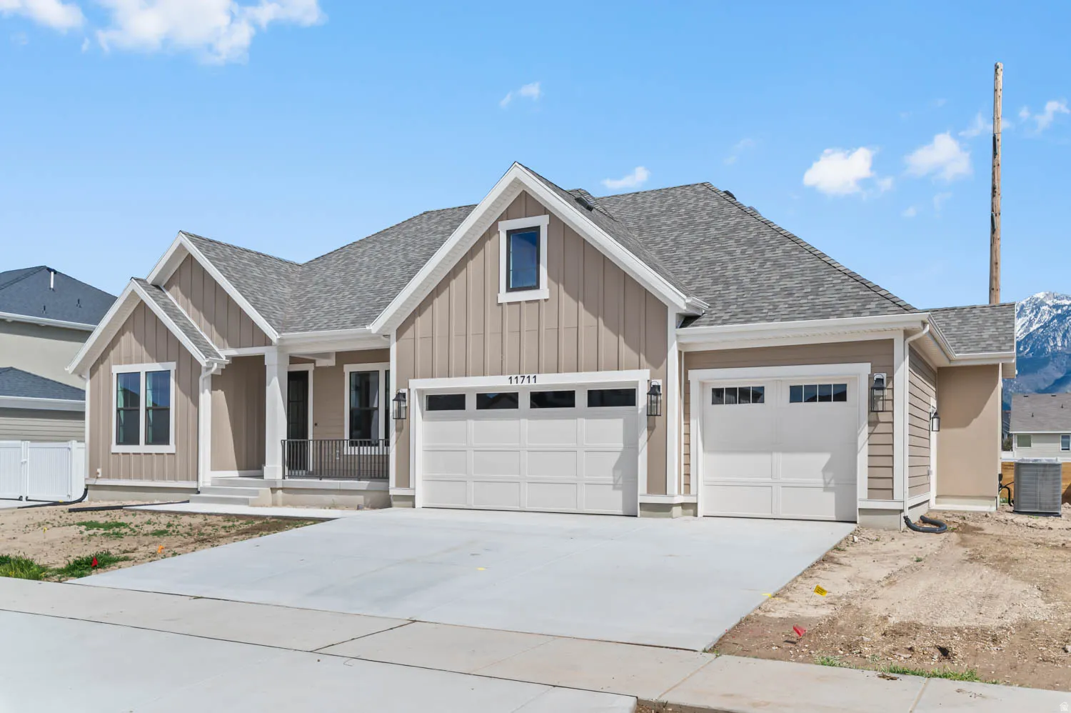 Contemporary residence featuring board and batten siding with contrasting trim
