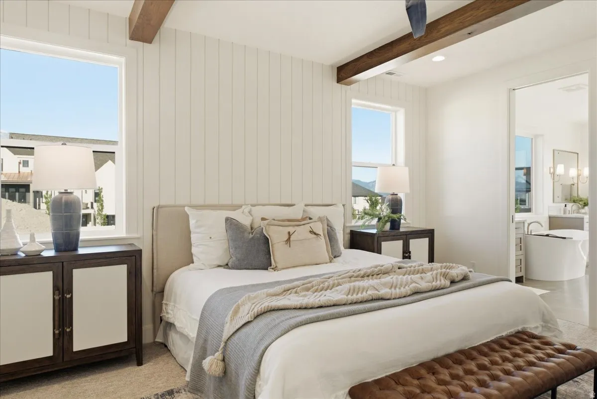 Bedroom featuring vertical shiplap accent wall, exposed wood beams, and recessed lighting