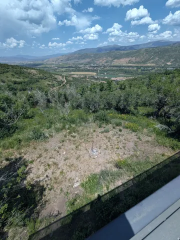 Expansive hillside acreage offering panoramic vistas across the valley below