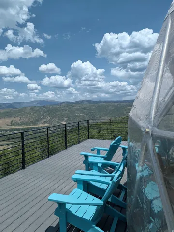 Expansive outdoor deck featuring composite decking and a horizontal cable railing system