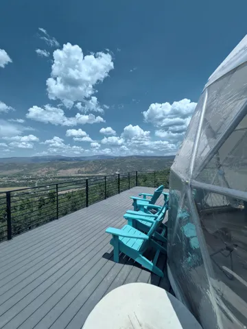 Expansive outdoor deck featuring composite decking and a cable railing system
