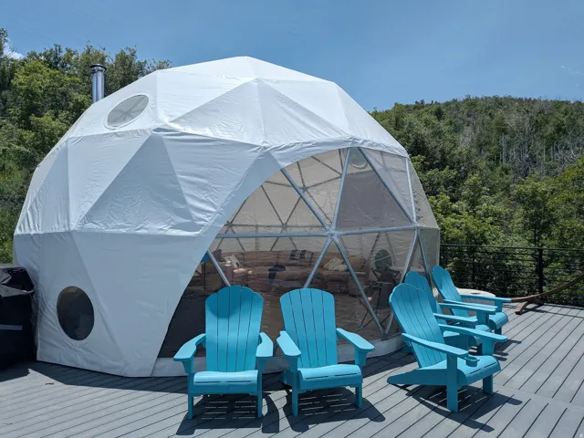 Geodesic dome structure featuring a partial transparent facade