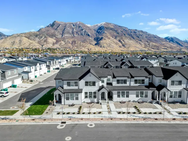 Modern residential development featuring a mountain backdrop