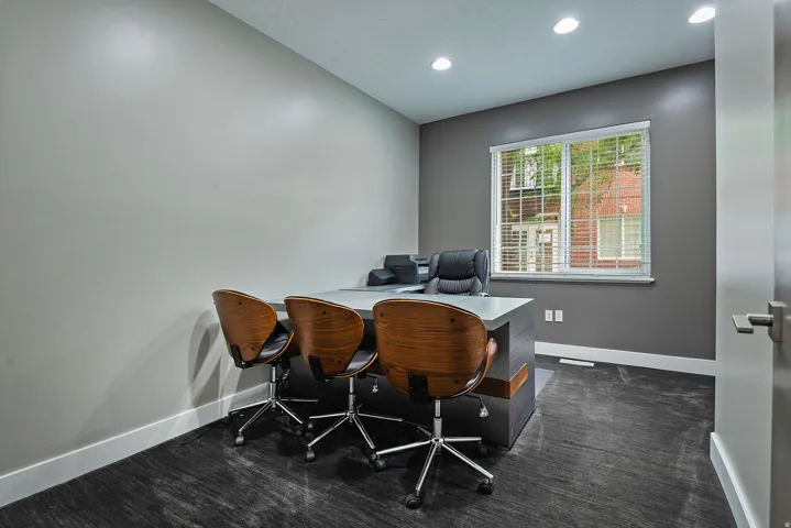 Interior space featuring recessed lighting, a window with horizontal blinds, and dark-toned flooring