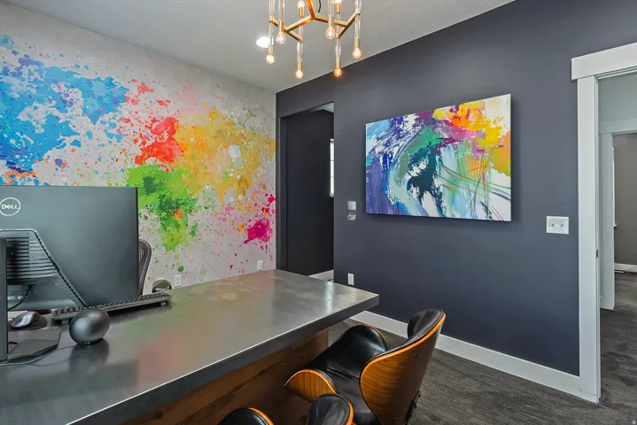 Dedicated interior space featuring a striking colorful accent wall