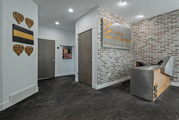 Textured brick accent wall complementing a modern reception desk