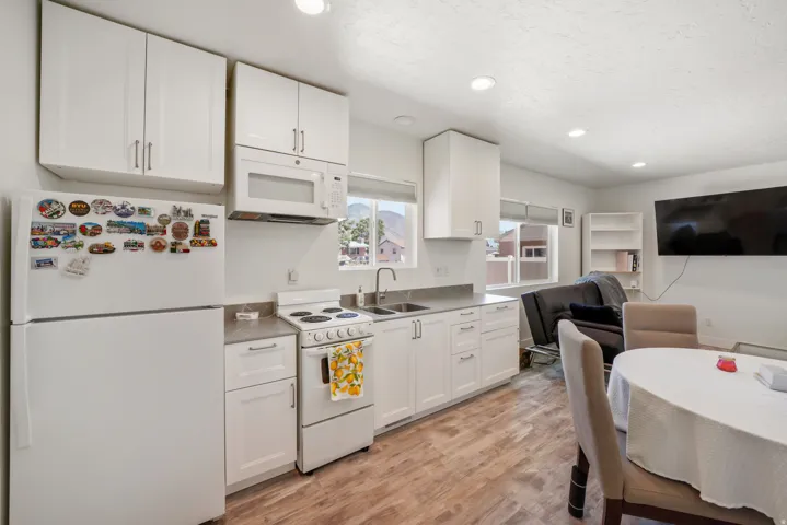 Open-concept living space with wood-finish flooring