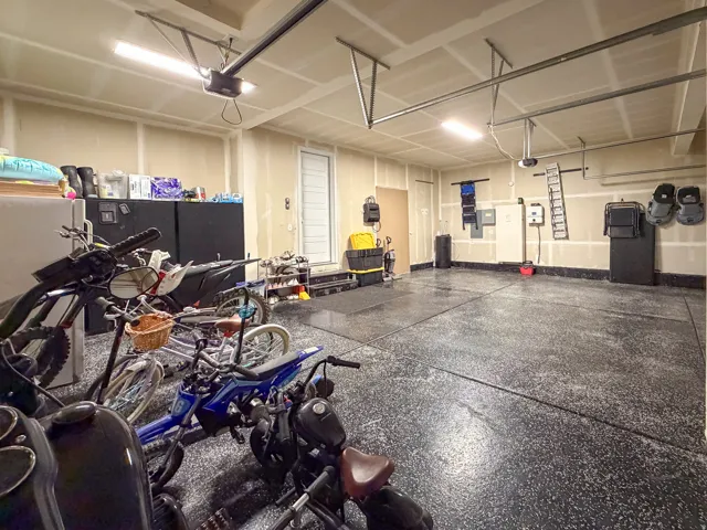 Spacious garage featuring a durable speckled epoxy floor finish