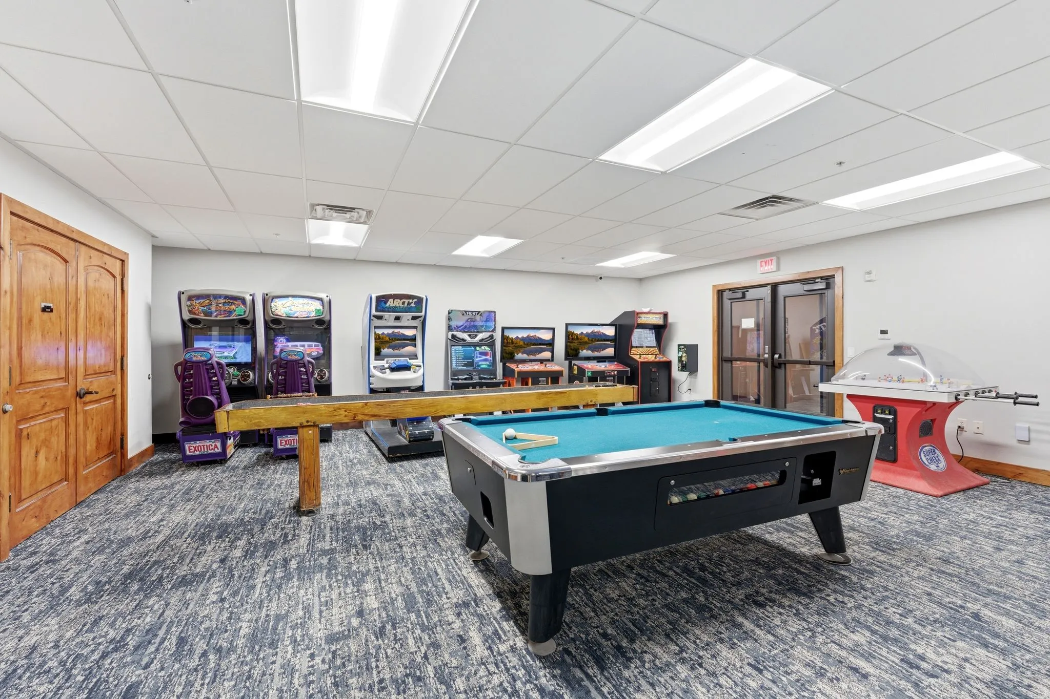 Recreational room featuring a pool table, carpeted flooring, white walls, and built-in ceiling light panels
