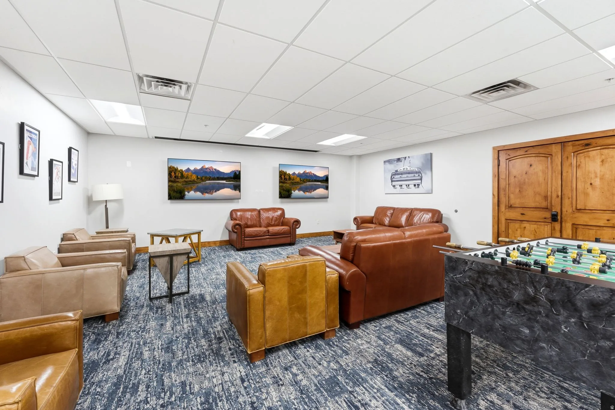 Spacious interior with an acoustic tile ceiling and recessed lighting