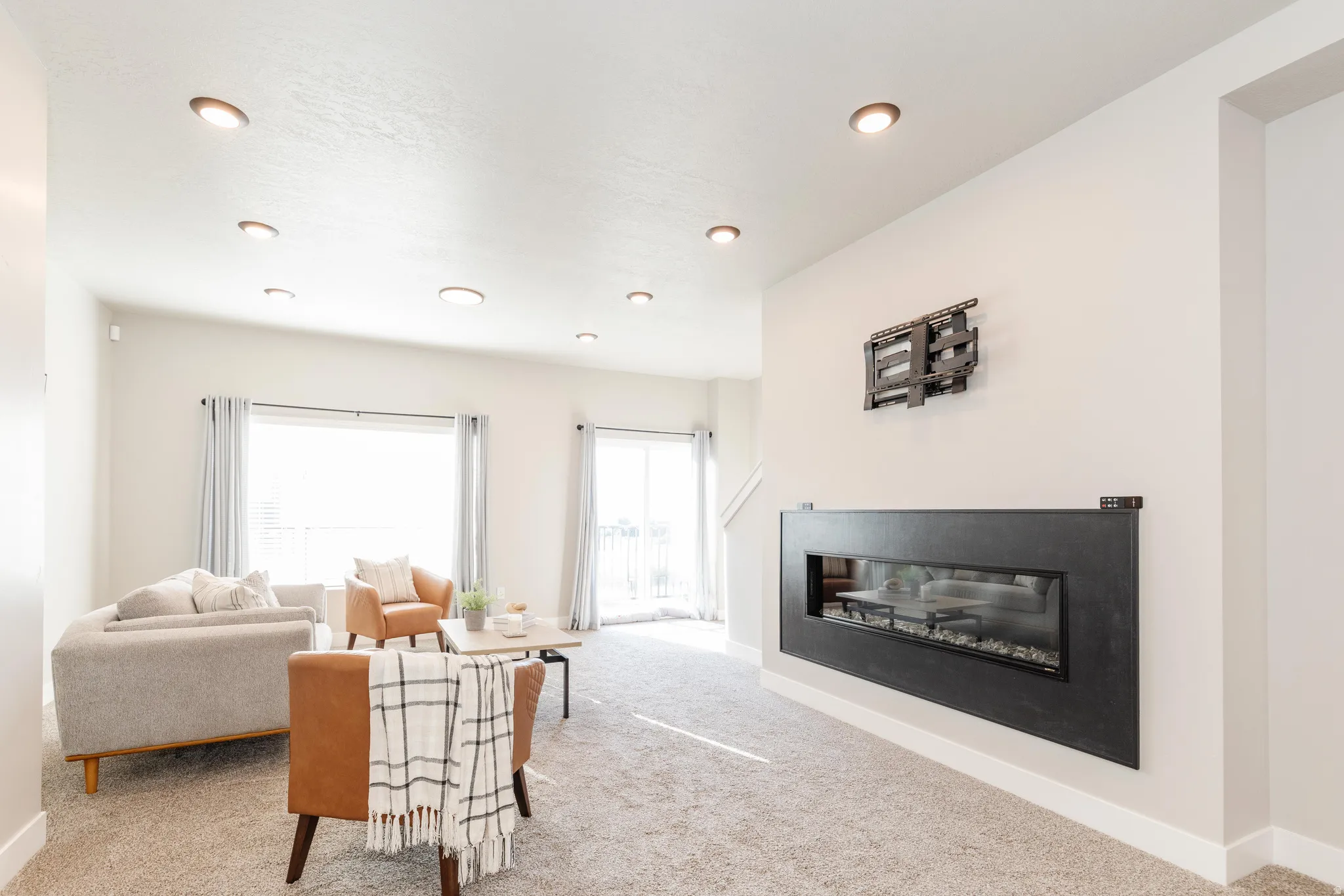 Contemporary linear fireplace with a black surround