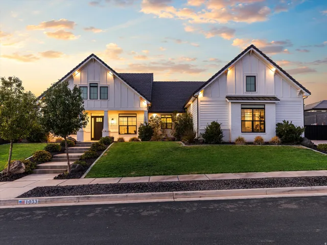 Modern farmhouse exterior featuring white board and batten and horizontal siding