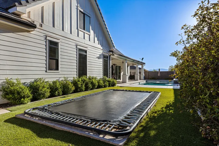 Rear exterior featuring board and batten siding and horizontal siding
