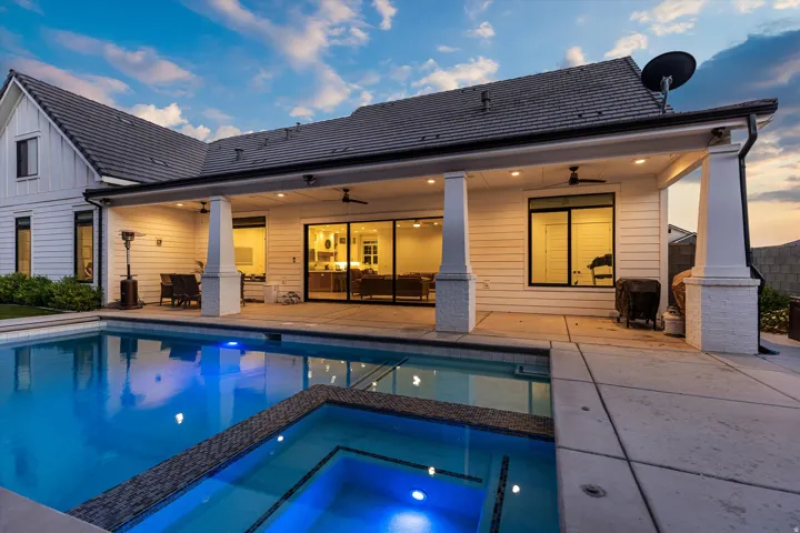 Backyard oasis featuring a sparkling pool with an integrated spa