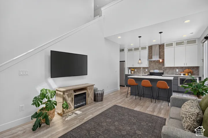 Open-concept living area with wood-finish flooring