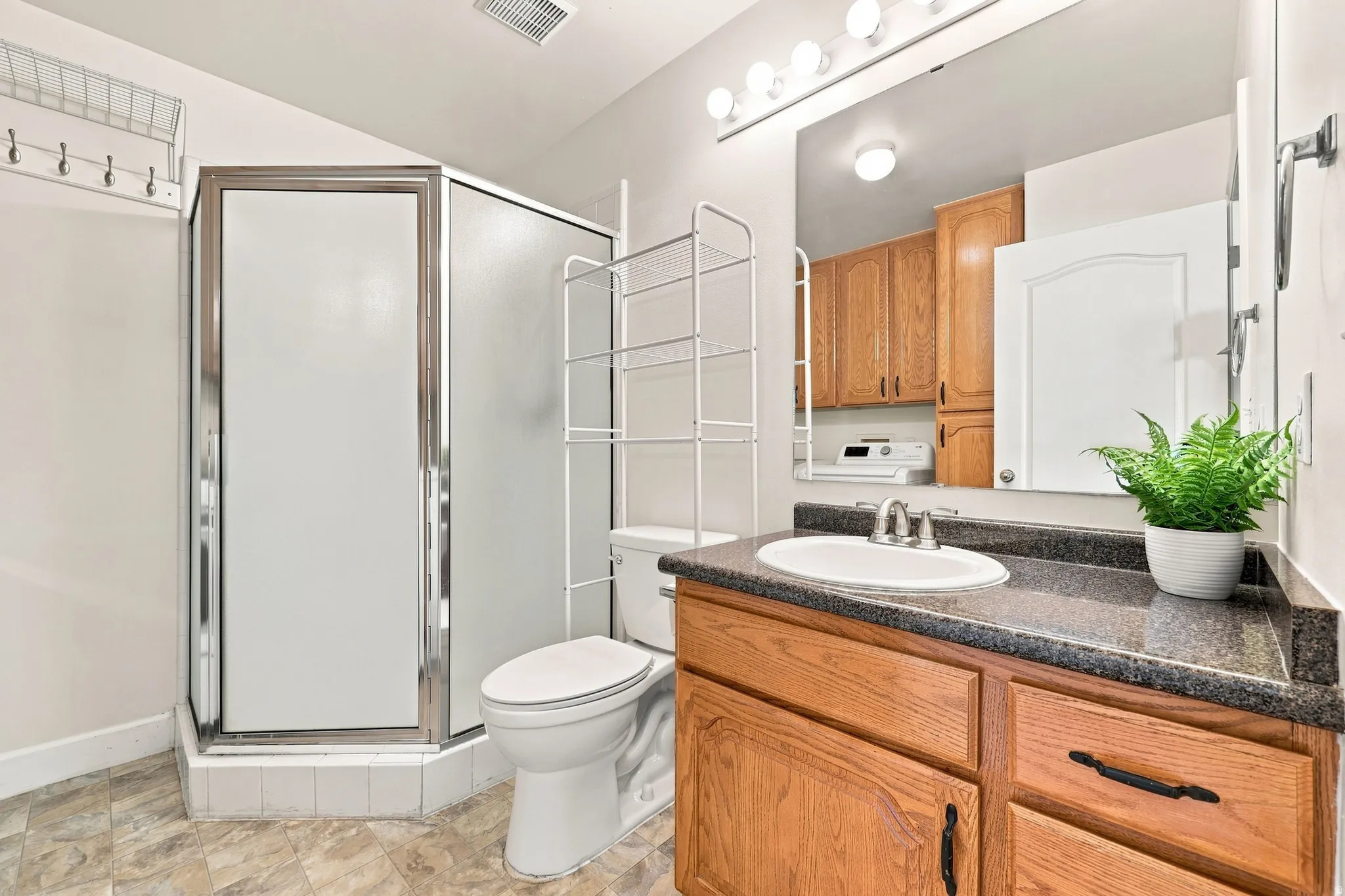 Bathroom with laundry room for second bedroom to use