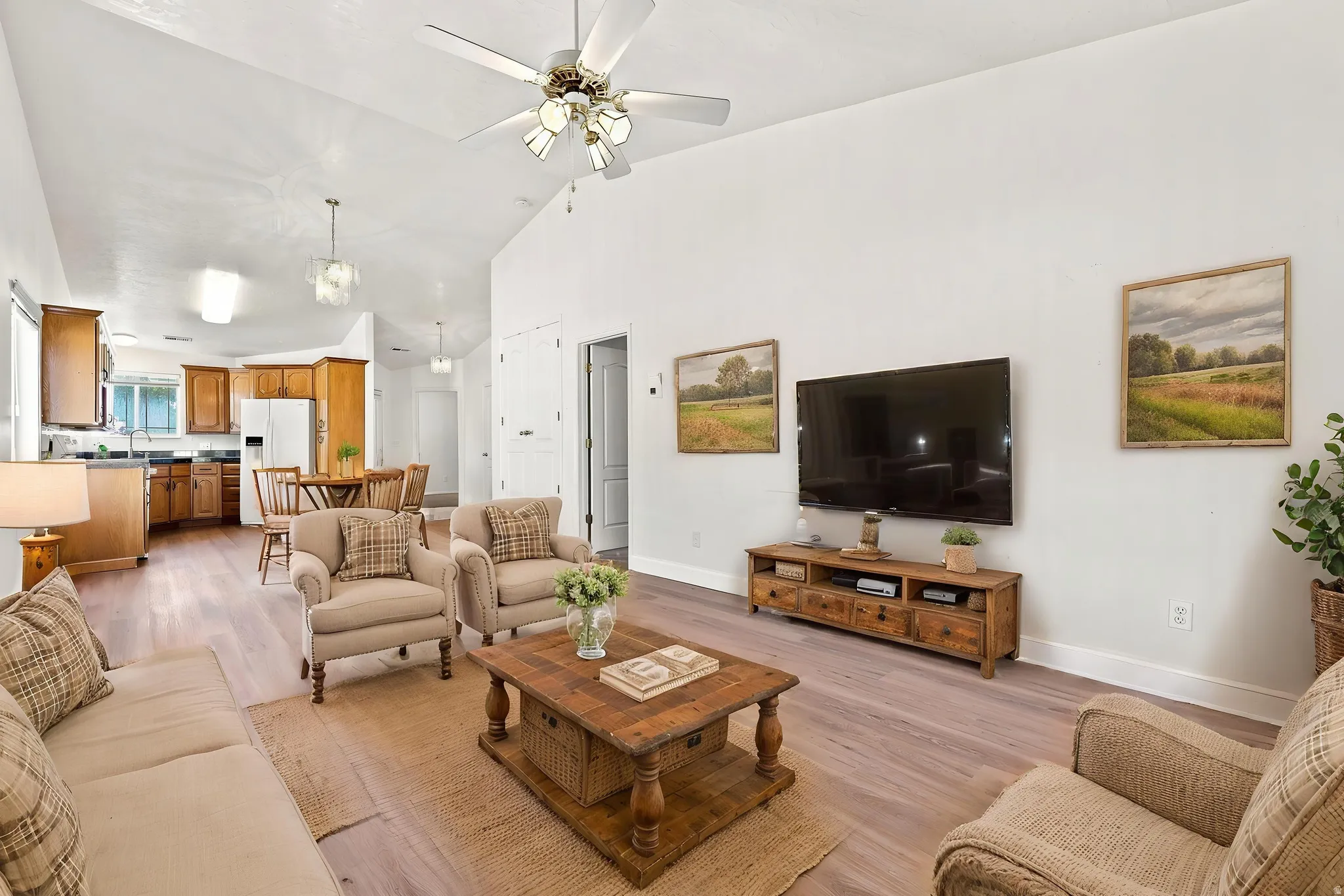 Virtually staged, looking towards kitchen and front door