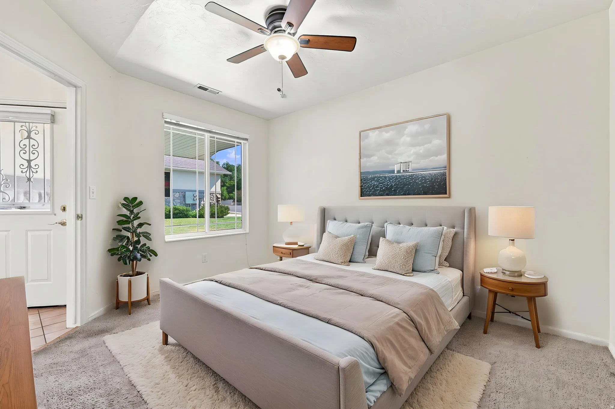 Virtually staged second bedroom next to front door