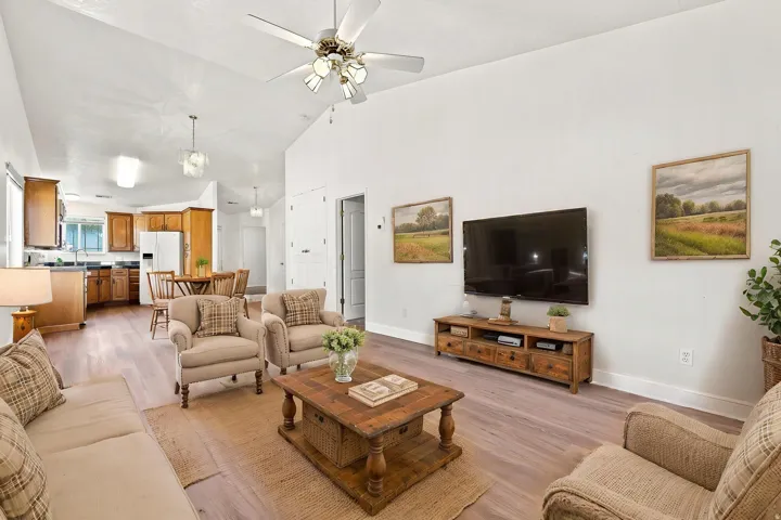 Virtually staged, looking towards kitchen and front door