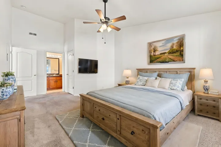 Virtually staged Master Room looking into private bathroom