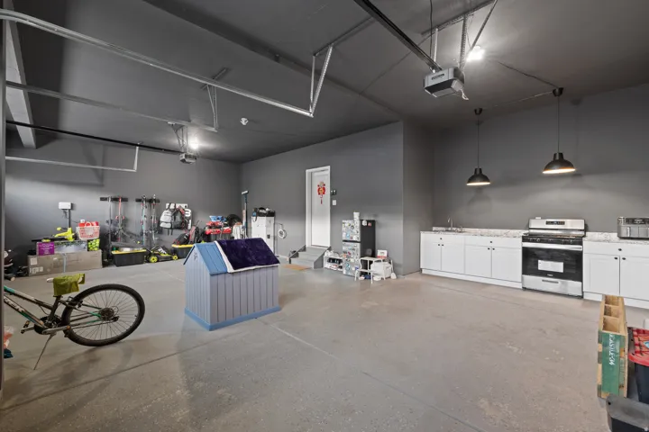 Spacious garage featuring concrete flooring and dark gray walls