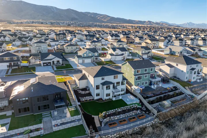 Modern residential community featuring varied architectural styles and mountain backdrops