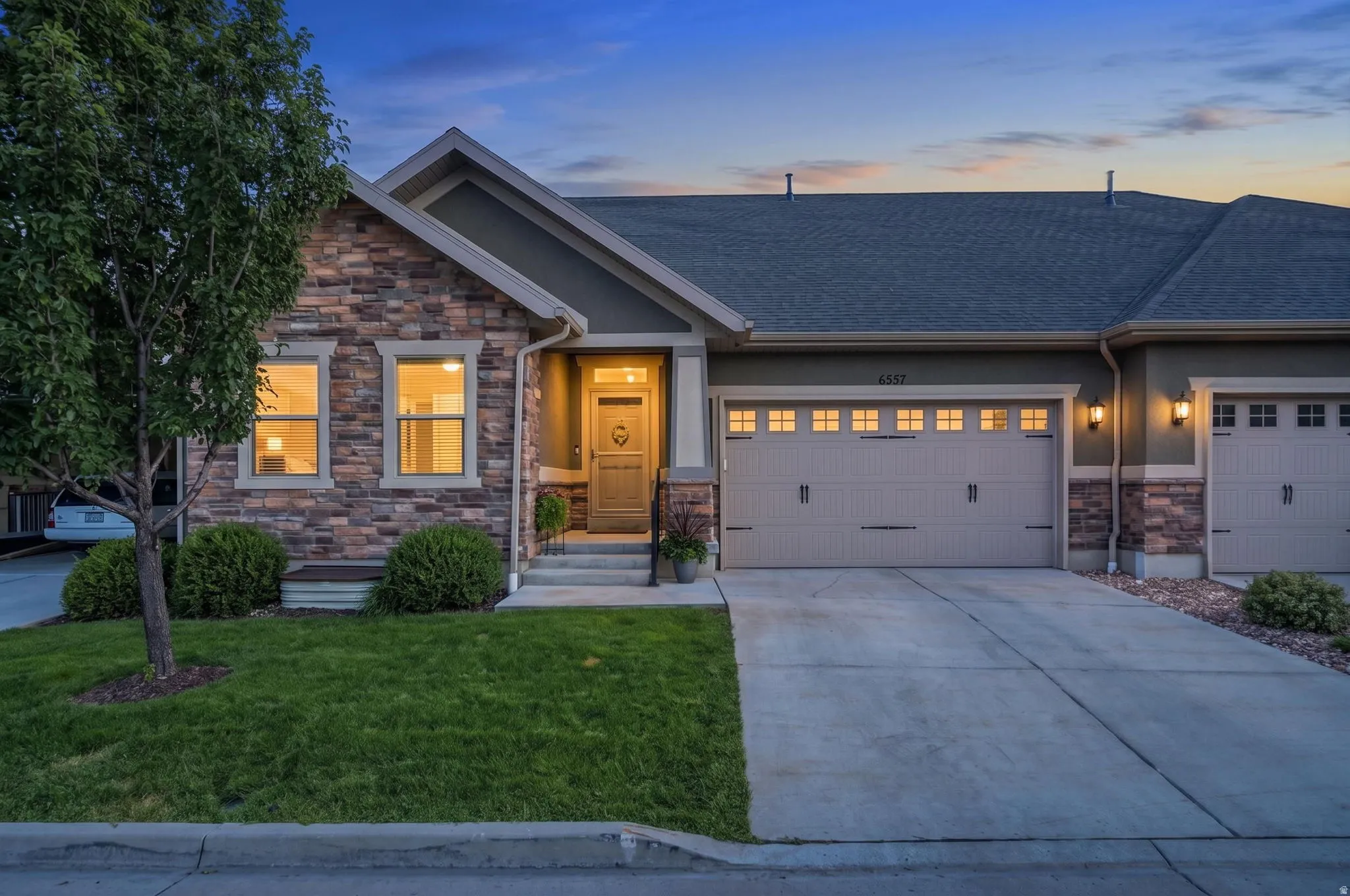Twilight view of this luxury townhouse.  A quiet, safe, and welcoming community where neighbors know and look out for one another,
