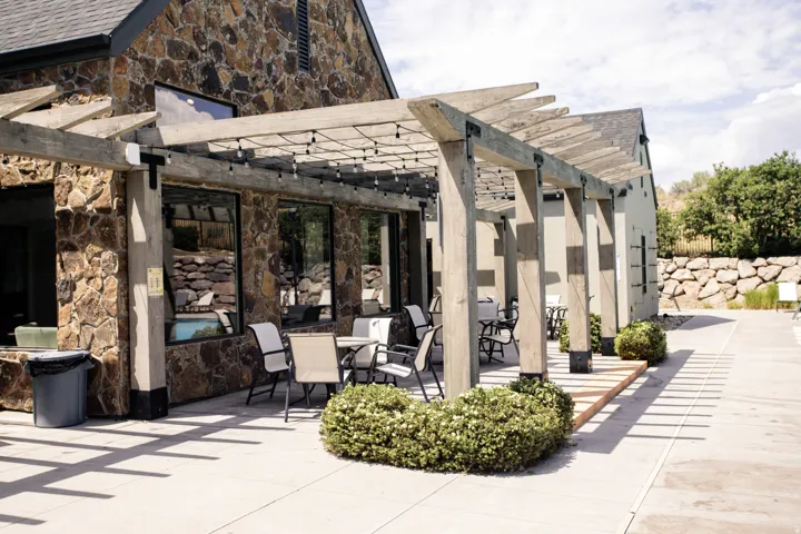 Relax and enjoy the expansive patio by the pool.