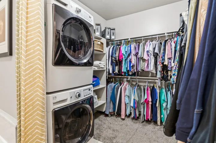 TALK ABOUT CONVENIENCE!  You will LOVE having your Integrated laundry area with stacked appliances.  Custom shelving and LOTS of room for all your wardrobe needs!!!