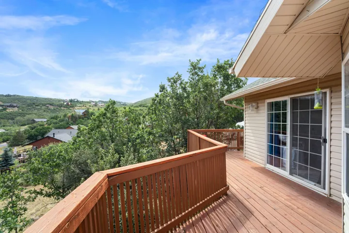Spacious outdoor deck with wood-finish flooring and matching railings