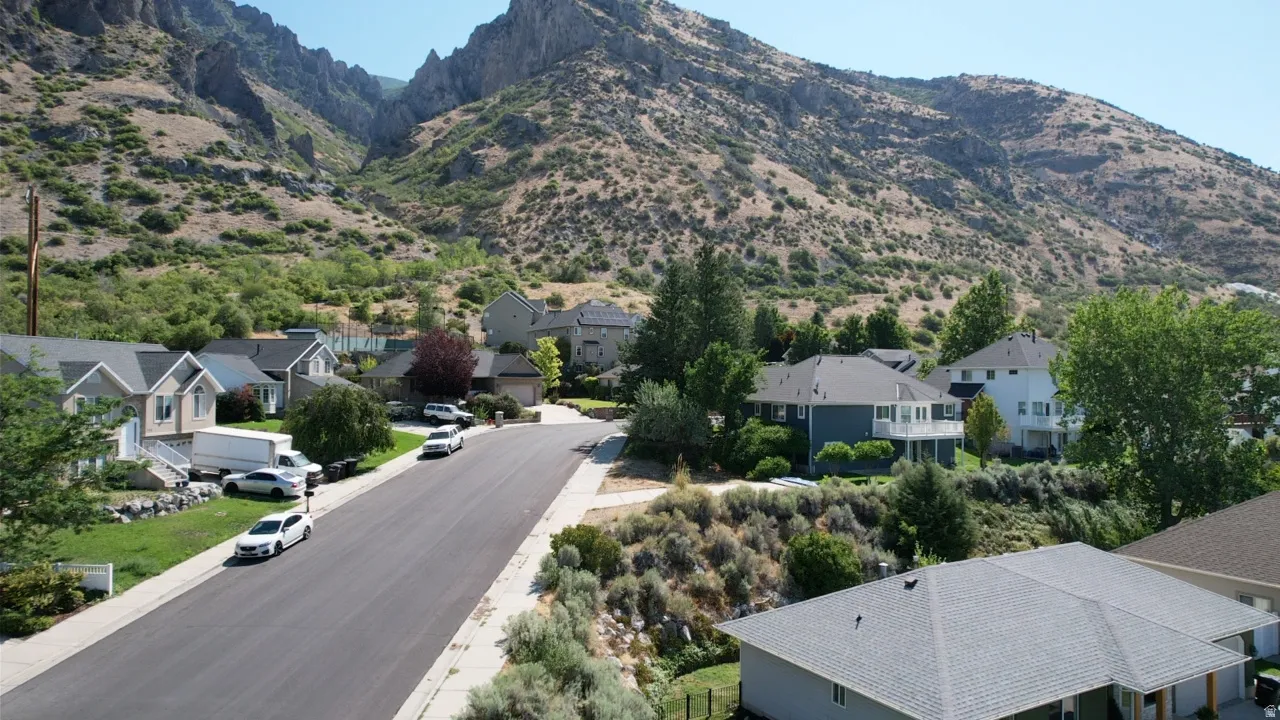 Mountainous terrain backdrop framing a residential street
