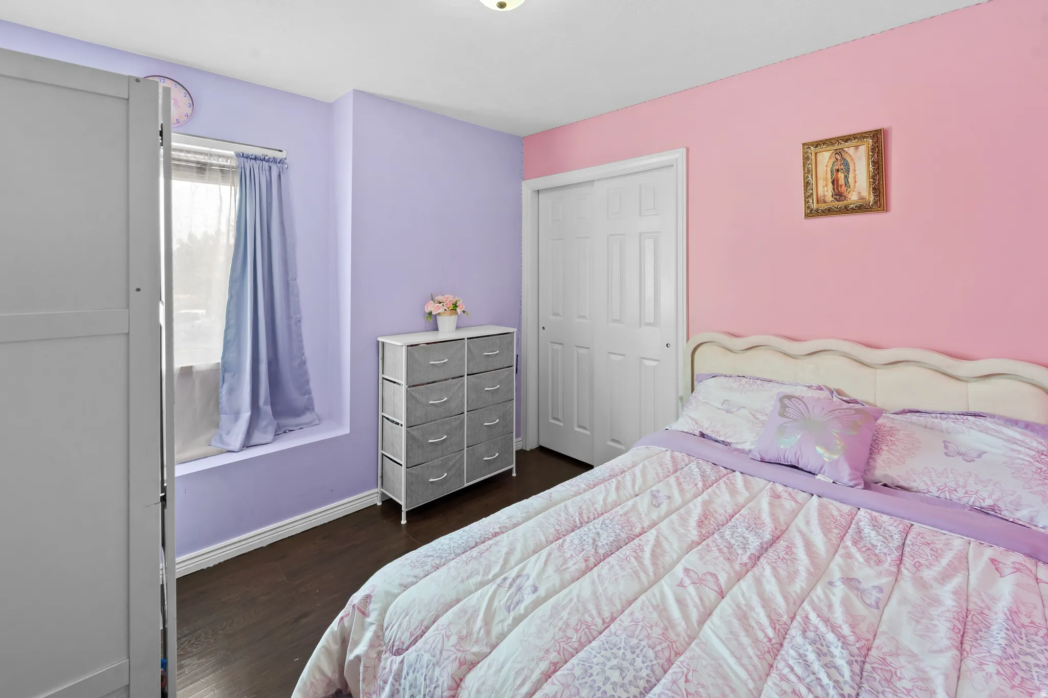 Wood-finish flooring with a window featuring a sill